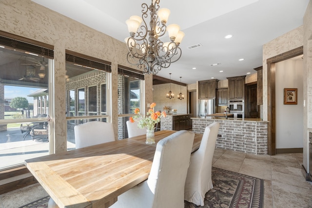 dining room with a wealth of natural light, recessed lighting, visible vents, and a notable chandelier