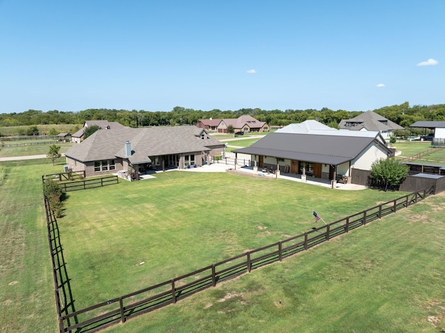 birds eye view of property featuring a rural view