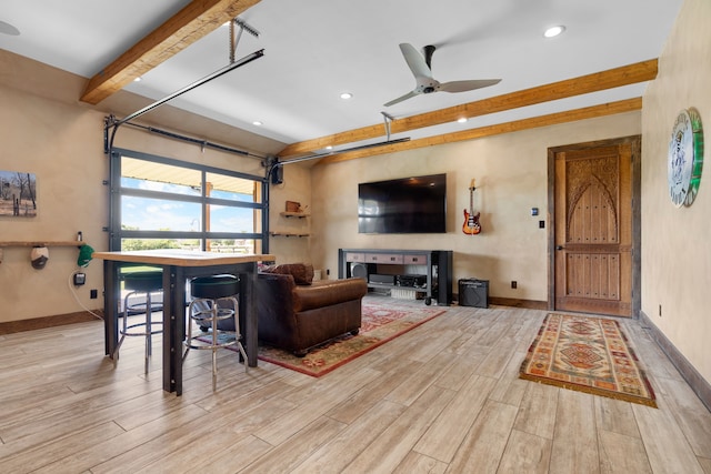living area with ceiling fan, beamed ceiling, recessed lighting, and wood finished floors