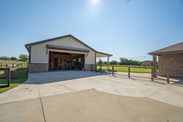 garage featuring a garage and fence