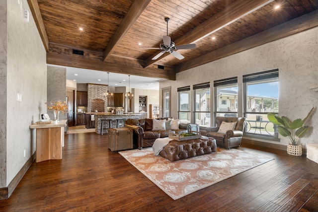 living room with ceiling fan with notable chandelier, dark wood-type flooring, wooden ceiling, and beamed ceiling