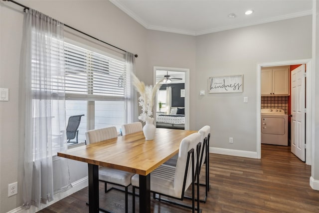 dining area with dark wood-type flooring, crown molding, and washer / dryer