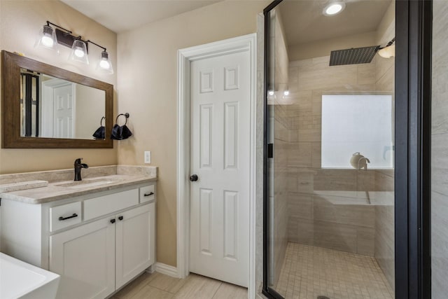 bathroom featuring vanity, tile patterned flooring, and a shower with door