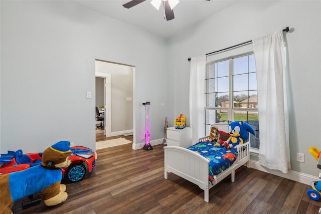 bedroom featuring dark wood-type flooring and ceiling fan