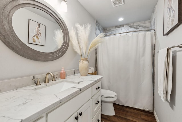 bathroom with vanity, toilet, a shower with shower curtain, and wood-type flooring