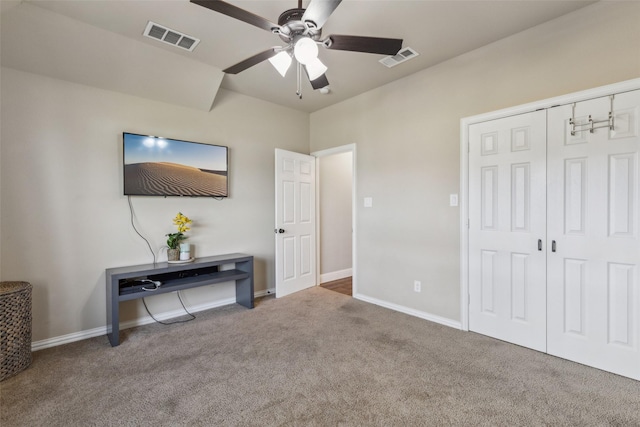 carpeted bedroom with a closet and ceiling fan