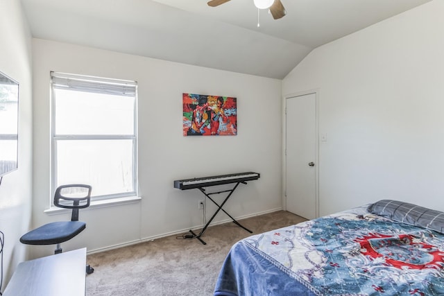 bedroom featuring carpet flooring, vaulted ceiling, and ceiling fan