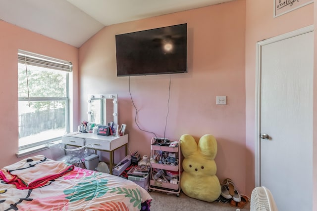 carpeted bedroom featuring vaulted ceiling