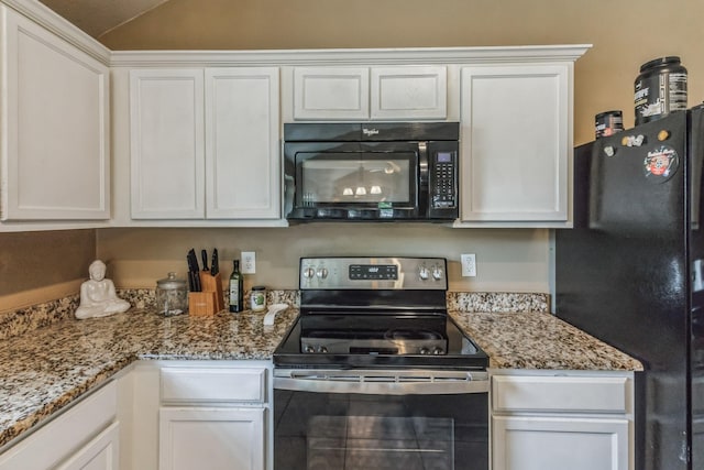 kitchen featuring light stone countertops, white cabinetry, and black appliances