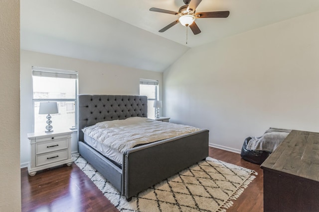 bedroom with ceiling fan, dark hardwood / wood-style floors, and lofted ceiling