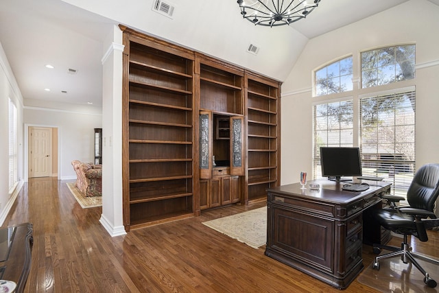 office featuring lofted ceiling and dark hardwood / wood-style flooring