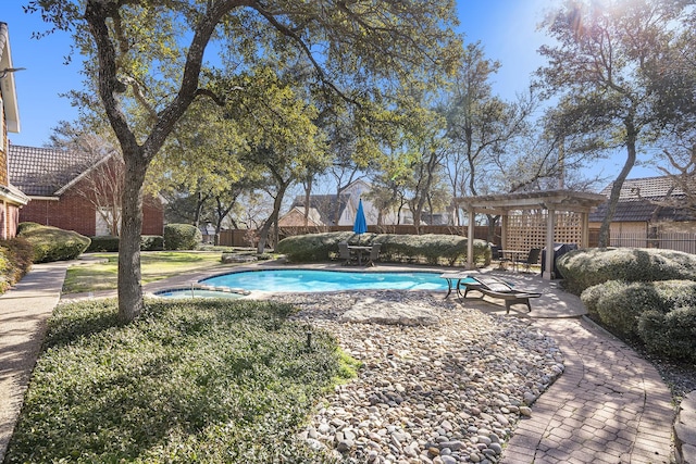 view of swimming pool with a pergola