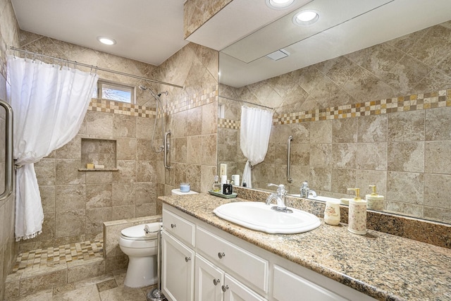 bathroom featuring tile walls, vanity, a shower with curtain, and toilet