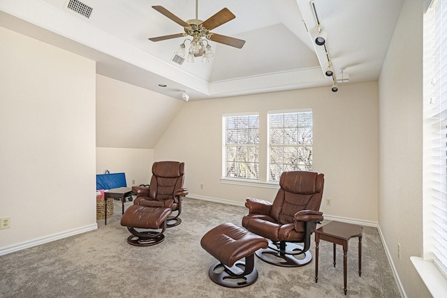 living area featuring ceiling fan, track lighting, lofted ceiling, and carpet floors