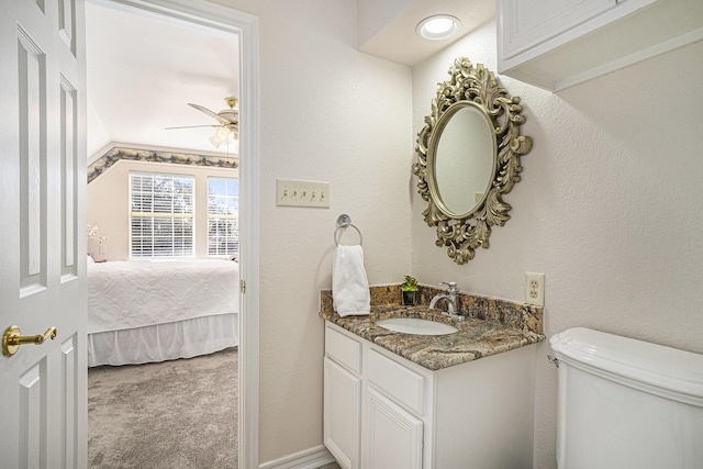 bathroom featuring vanity, ceiling fan, and toilet