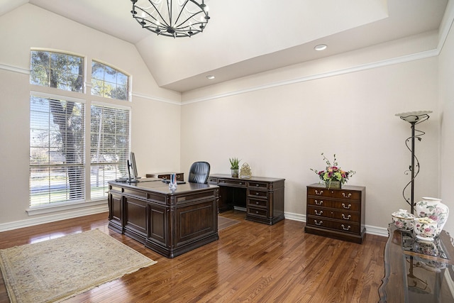 home office with vaulted ceiling, dark hardwood / wood-style floors, and a healthy amount of sunlight