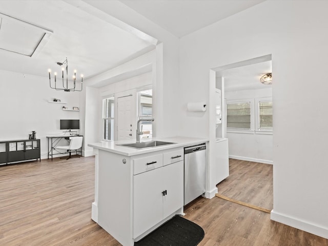 kitchen featuring sink, white cabinetry, light hardwood / wood-style flooring, and dishwasher