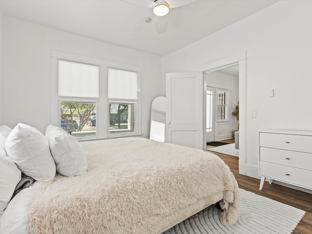 bedroom featuring dark wood-type flooring and ceiling fan