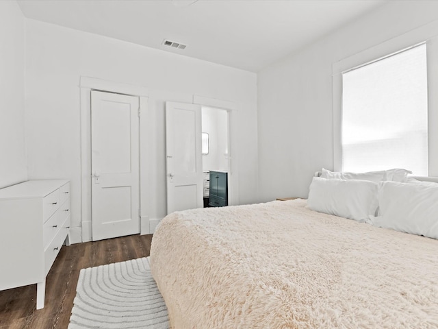 bedroom featuring dark wood-type flooring