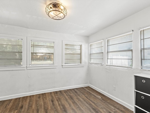 unfurnished room featuring dark hardwood / wood-style flooring