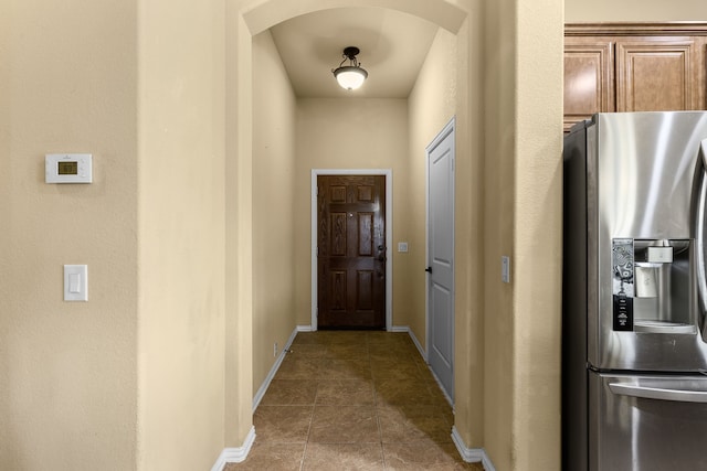 hallway with tile patterned floors