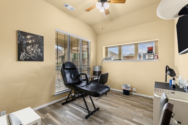 office area with lofted ceiling, hardwood / wood-style floors, and ceiling fan