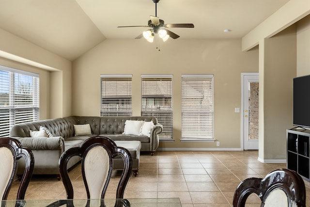 living room featuring ceiling fan, light tile patterned flooring, and lofted ceiling