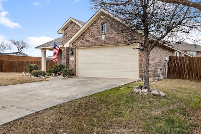 view of front facade featuring a garage and a front lawn