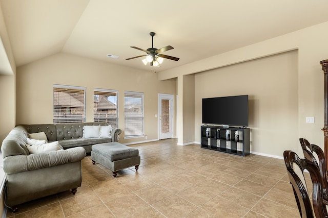 living room with light tile patterned flooring, ceiling fan, and lofted ceiling