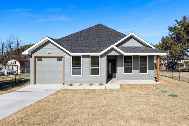 single story home featuring a garage and a front lawn