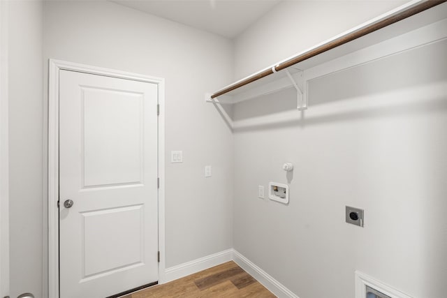 washroom with gas dryer hookup, hookup for an electric dryer, light hardwood / wood-style flooring, and hookup for a washing machine