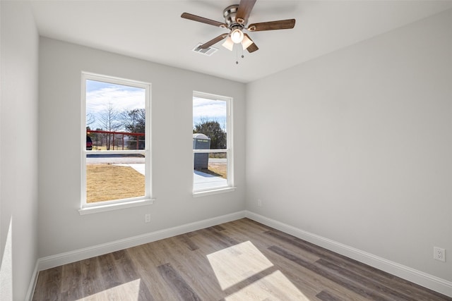 spare room featuring ceiling fan and light hardwood / wood-style flooring