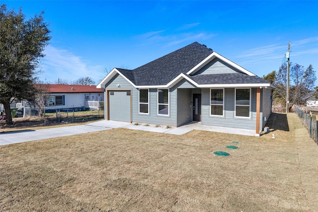 view of front facade with a garage and a front yard