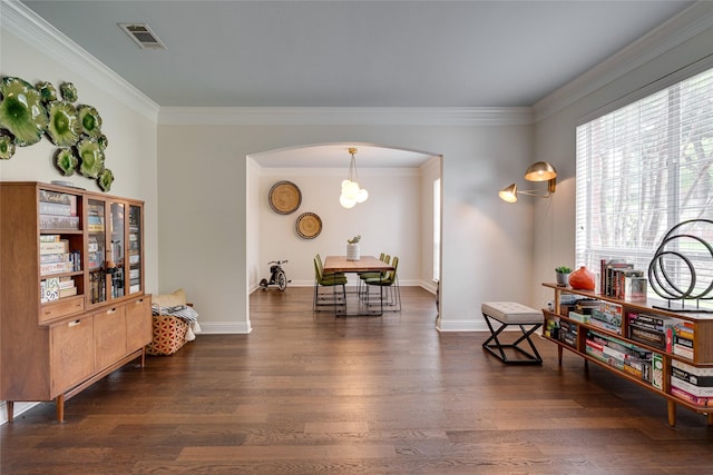 sitting room with ornamental molding and dark hardwood / wood-style flooring