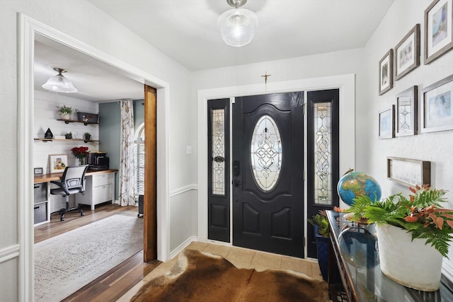 foyer entrance with wood-type flooring