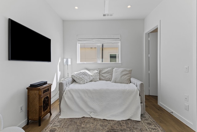 bedroom with hardwood / wood-style flooring