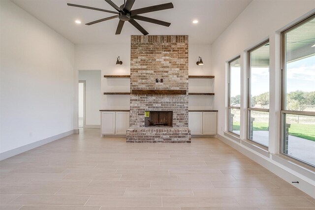 empty room featuring ceiling fan and light colored carpet