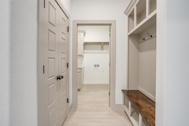 mudroom with light hardwood / wood-style floors