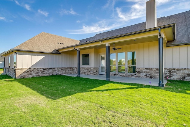 rear view of house featuring a patio area, a yard, and ceiling fan