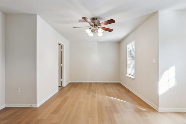 unfurnished room with ceiling fan and light wood-type flooring