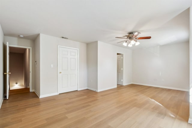 spare room featuring ceiling fan and light hardwood / wood-style flooring