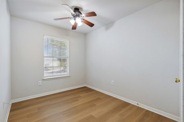 spare room with ceiling fan and light hardwood / wood-style flooring