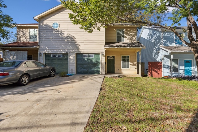 front facade with a garage and a front lawn