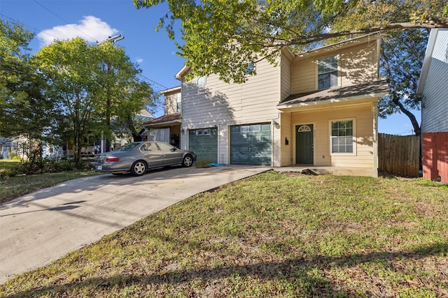 front of property featuring a garage and a front lawn