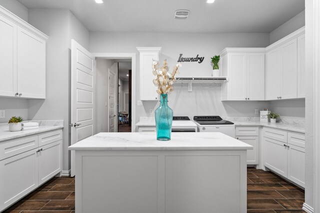 laundry area with cabinets and separate washer and dryer