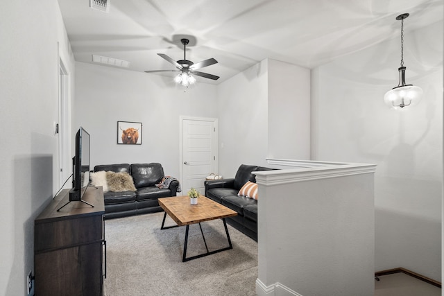 living room with light carpet and ceiling fan