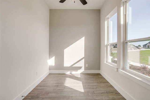 unfurnished room featuring light hardwood / wood-style floors and ceiling fan