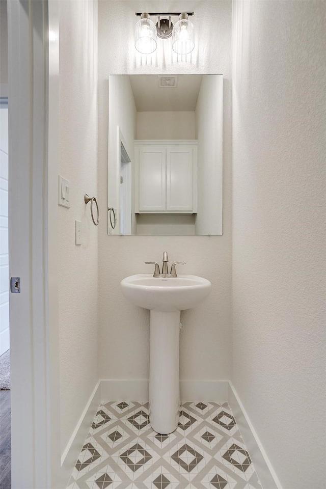 bathroom featuring sink and tile patterned floors