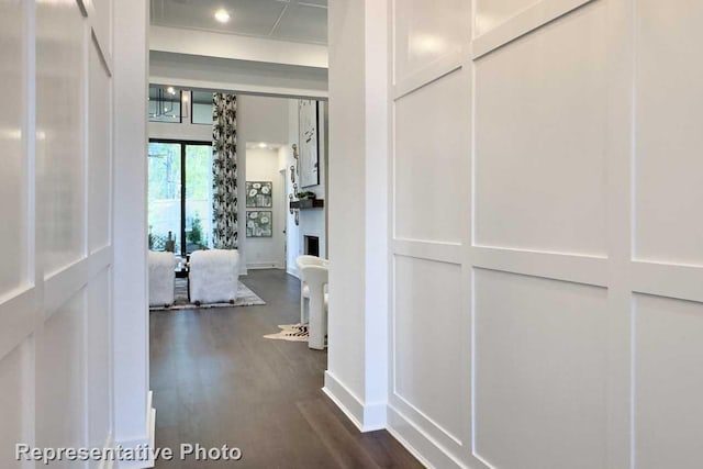 hallway with dark hardwood / wood-style floors