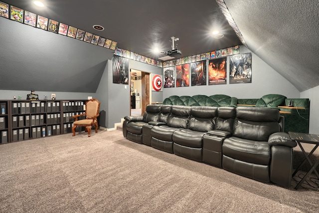 carpeted cinema featuring a textured ceiling and lofted ceiling